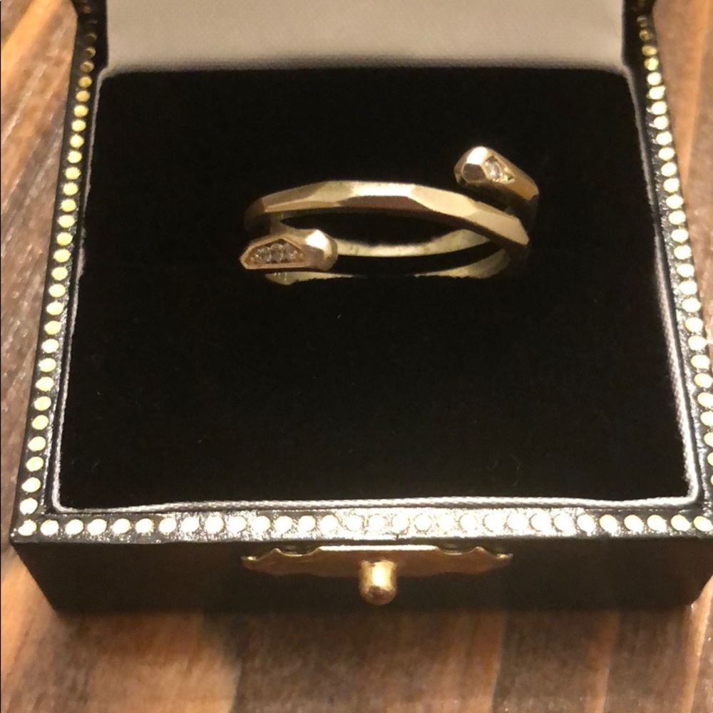 Gold Kendra Scott ring.